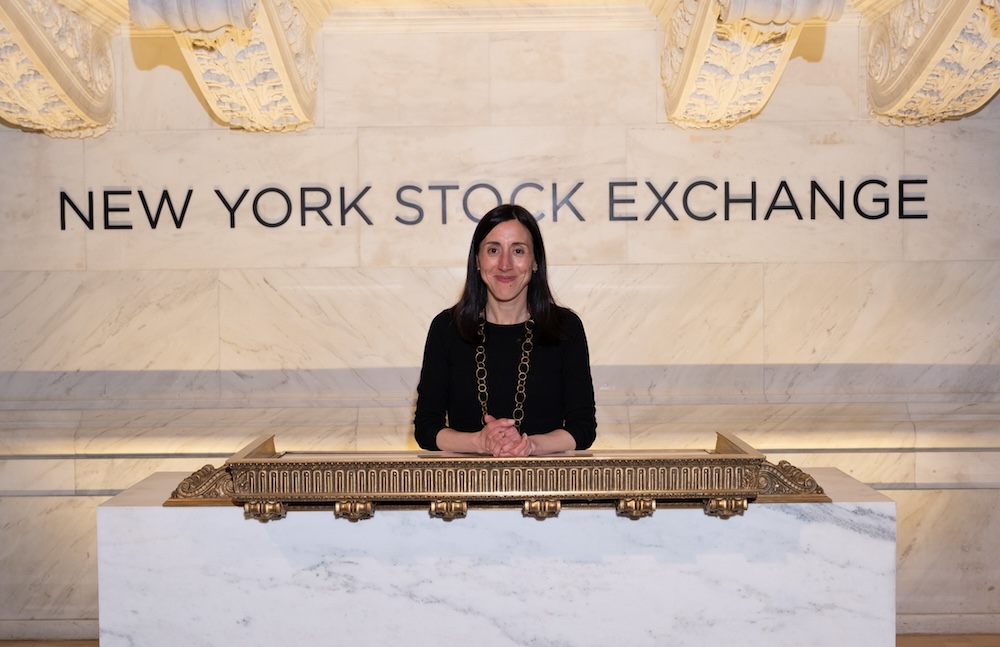 Woman standing in front of NYSE sign